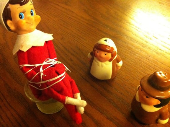 Thanksgiving Elf on a Shelf Ideas | Elf Tied Up by Pilgrims