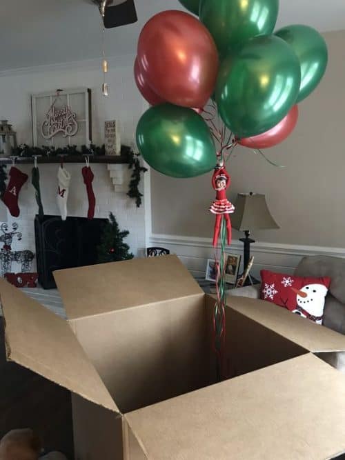 Elf on the Shelf Returns in a Cardboard Box with Balloons