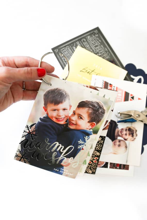 hand holding Christmas Cards on a Binder Ring 