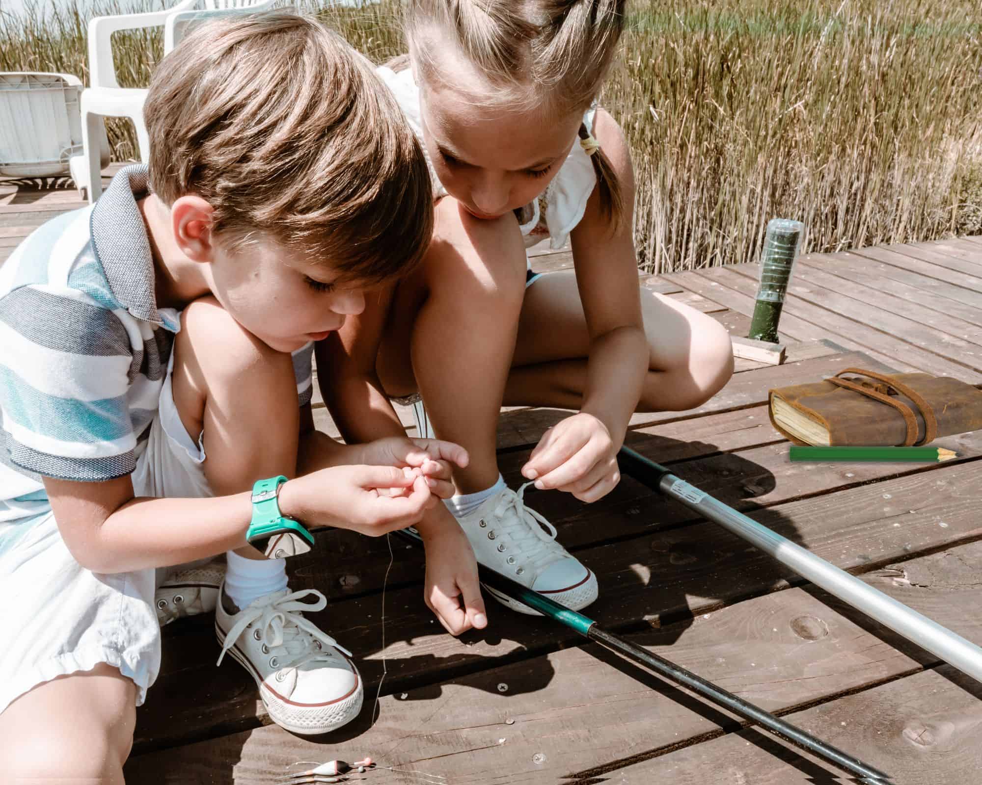 kids having fun at a pond with a fishing pole